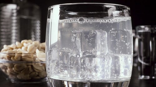 Refreshing Bubbly Drink with Ice Cubes Close Up