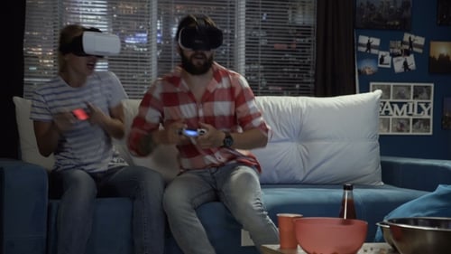 Couple Playing VR Games in Apartment at Night