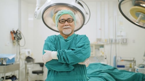 Portrait of Senior Male Surgeon in Operating Theater