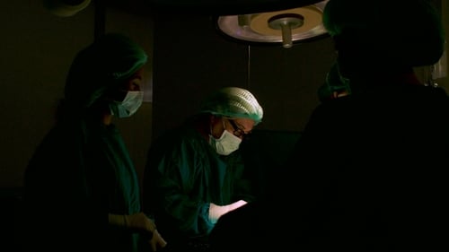 Team of Surgeons in Operating Theater.