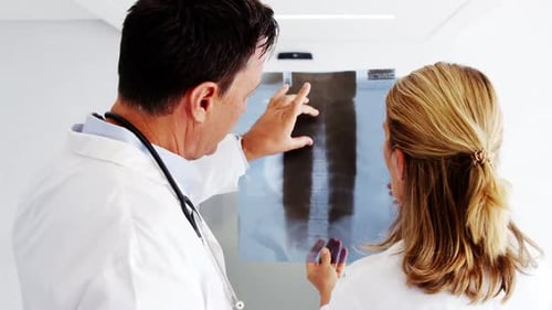 Doctors checking x-ray report