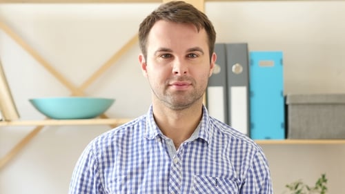 Okay, Satisfied Man Sitting in Office