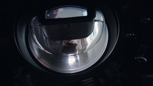 Man Removing Laundry from Washing Machine, Interior View