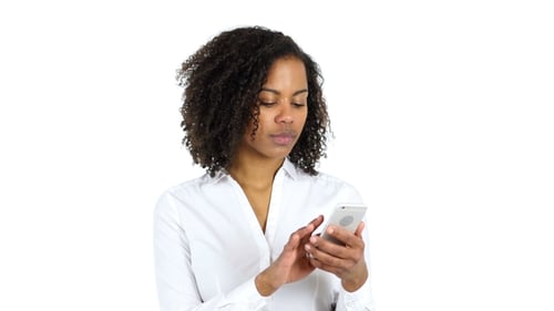 Young Woman Uses Cellphone on White Background