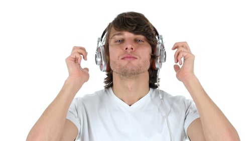 Young Man Puts on Headphones and Dances
