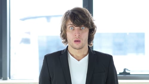 Man Looks at Camera with a Shocked Expression