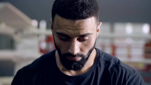 . Portrait of a Man with a Beard. He's Tense and Thoughtful. Piercing Glance at the Camera