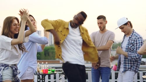 Young Adults Dancing at Rooftop Party