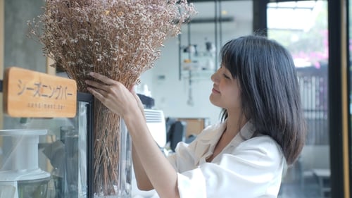 Portrait of Asian Woman Smiling in Coffee Shop Cafe Vintage Color Tone