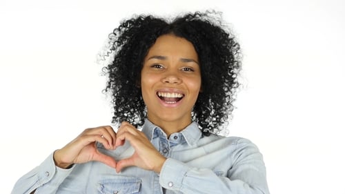Smiling Woman Making Heart Shape with Hands