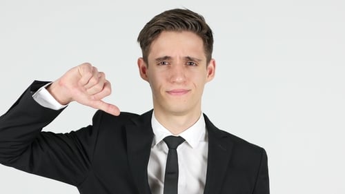 Thumbs Down By Businessman, White Background