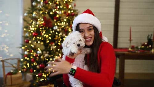 Woman and Dog Celebrate Christmas at Home