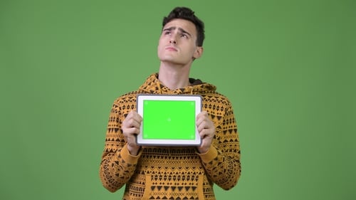 Young Adult Holding Tablet with Green Screen