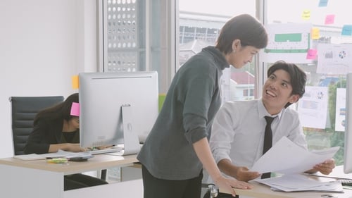 Colleagues Working Together in Bright Modern Office