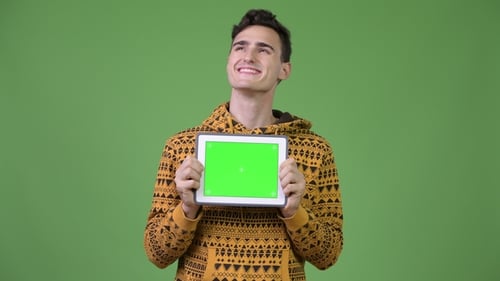 Young Adult Holding Tablet with Green Screen