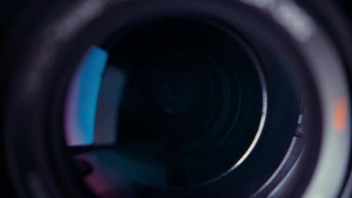 the lens of a movie camera or photo camera is shot in close-up