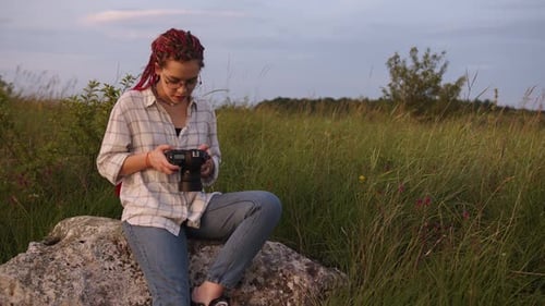 Close Up View of a Girl That Look on the Camera and Smiles