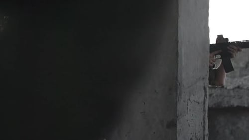 Soldiers Armed with Rifles in Derelict Building