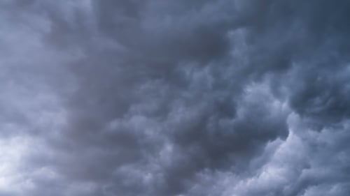 Gray Storm Clouds Moving in the Sky. . Thunderstorm Cyclone. Curly Clouds Are Low.