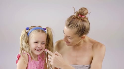 Cheerful Woman and Child Bonding in Close Up