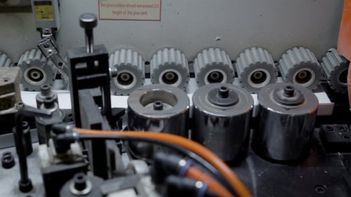 Shot of Gears Rotating in a Edge Banding Machine