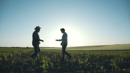 Meeting on the Field of Father and Son To Check the Farmland Management