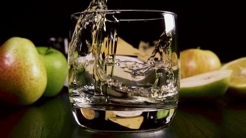 Clear Glass Filling with Liquid, Splash, Fruit