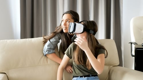 Girls Experiencing Virtual Reality in Living Room