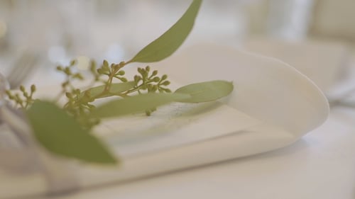 Elegant Wedding Table Setting with Ribbon and Greenery