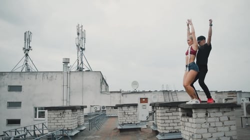 Man and Woman Dancing on Rooftop