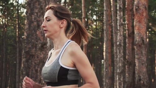 Woman Jogging in Forest, Health and Fitness