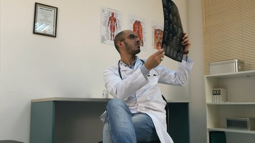 Doctor Reviewing Brain Scan in Bright Office