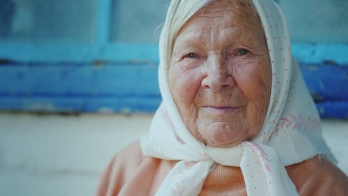 Portrait of an Elderly Woman. Looks at the Camera