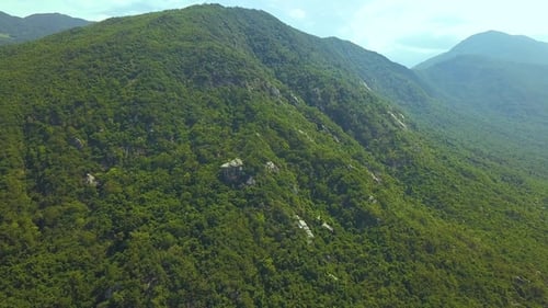 Green Mountain Covered Tropical Trees and Big Stones Aerial View. Beautiful Mountain Landscape From