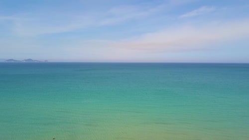 Turquoise Sea and Blue Sky Aerial View From Flying Drone. Beautiful Landscape Blue Ocean and Skyline