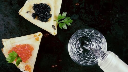 Pancakes with Caviar and Drink Overhead Shot