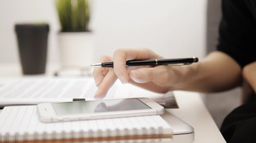 Phone use and signing document in office