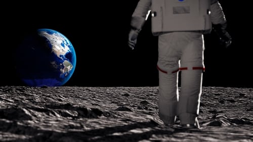 Astronaut Walks on Moon Surface with Earth in Background