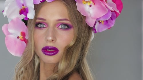 Woman Wearing Flower Crown and Pink Makeup Posing