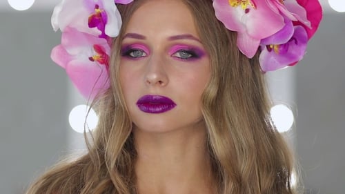 Woman with Flower Crown and Purple Makeup