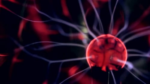 Red Plasma Ball with Glowing Tendrils on Black