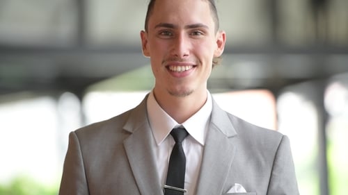 Close Up of Smiling Person in Suit