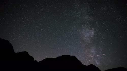 Starry Night Sky Time-Lapse over Mountain Silhouette