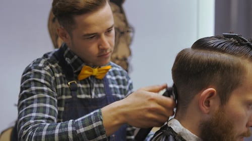 Hairdresser for Men. Barbershop. Hair Care. Hairdresser with a Haircut Works for a Hairstyle for a