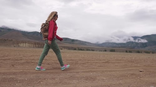 Woman Hiking in a Mountain Landscape