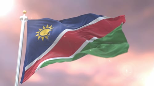 Namibia Flag Waving Seamlessly Against a Beautiful Sky Loop
