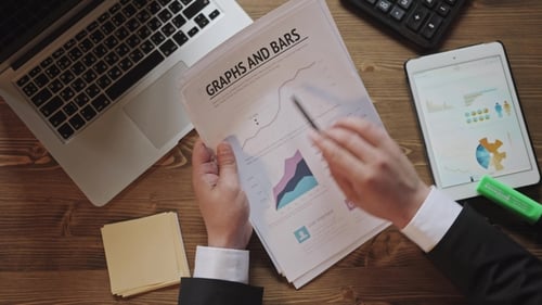 Top View Businessman Working at Office Desk with His Laptop and Tablet