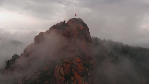 Aerial View of Fog Among the Mountain Peaks
