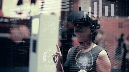 A Girl in Virtual Reality Glasses Uses a Futuristic Hologram