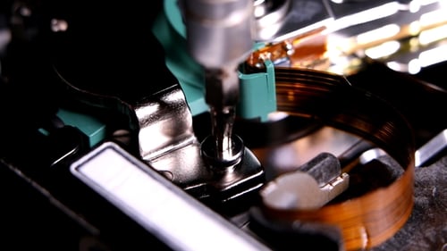 Electric Screwdriver Tightening a Small Screw